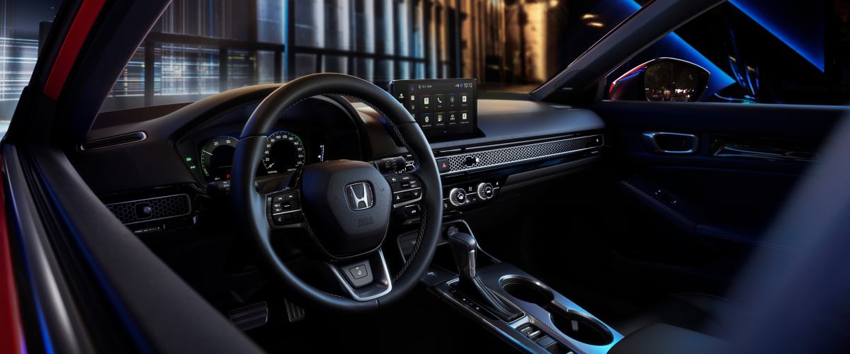 Interior view of steering wheel and cabin.