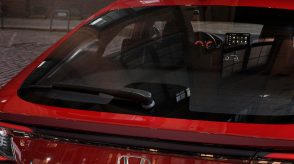 Closeup of hatch door on a red Hatchback. 