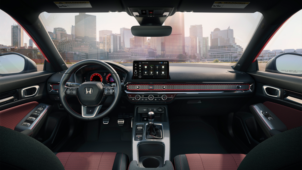 Panoramic view of steering wheel and front dashboard.